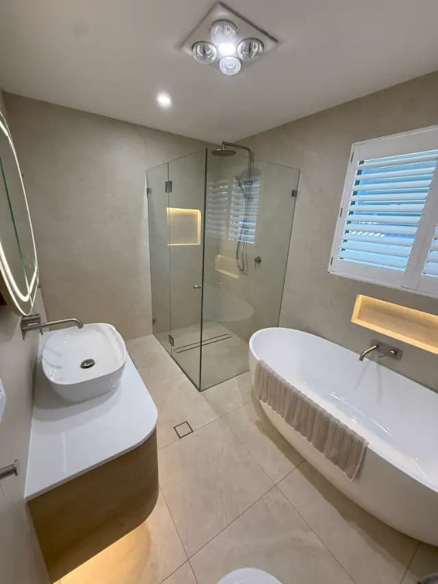 Completed bathroom with freestanding bath and walk-in shower